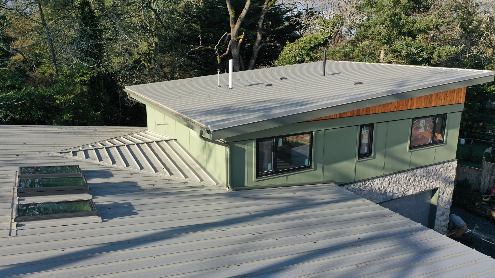 Low-slope metal roof and cricket detail at Salsbury